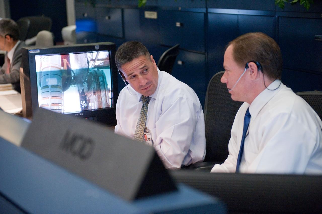 JSC2011-E-044259 (16 May 2011) --- John McCullough (right), chief of the Flight Director Office; and astronaut George Zamka are pictured at the MOD console in the space shuttle flight control room in the Mission Control Center at NASA's Johnson Space Center during launch countdown activities a few hundred miles away in Florida, site of space shuttle Endeavour's STS-134 launch. Liftoff was at 8:56 a.m. (EDT) on May 16, 2011, from Launch Pad 39A at NASA's Kennedy Space Center. Photo credit: NASA