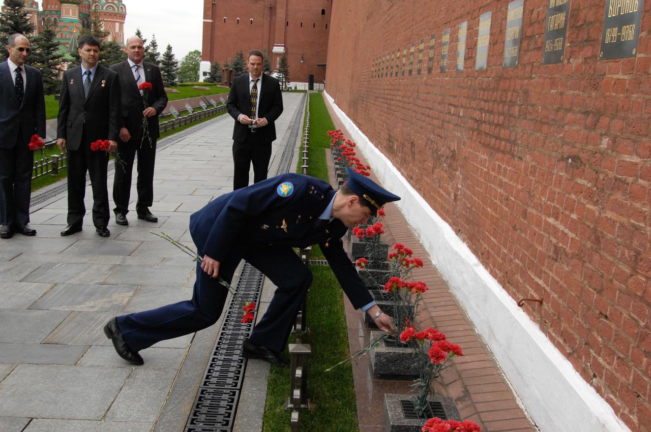 Expedition 28 Soyuz Commander Sergei Volkov lays flowers at the Kremlin Wall at Red Square in Moscow May 16, 2011 as part of the traditional activities leading to the launch of him and his crewmates, Flight Engineer Mike Fossum of NASA and Satoshi Furukawa of the Japan Aerospace Exploration Agency to the International Space Station June 8 in their Soyuz TMA-02M spacecraft from the Baikonur Cosmodrome in Kazakhstan. Looking on are backup crewmembers Don Pettit of NASA, Oleg Kononenko of Russia and Andre Kuipers of the European Space Agency.