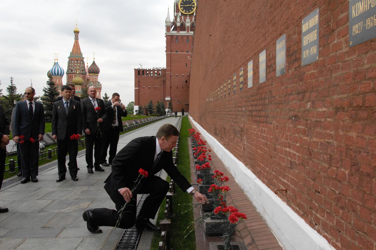 Expedition 28 Flight Engineer Mike Fossum of NASA lays flowers at the Kremlin Wall at Red Square in Moscow May 16, 2011 as part of the traditional activities leading to the launch of him and his crewmates, Soyuz Commander Sergei Volkov and Satoshi Furukawa of the Japan Aerospace Exploration Agency to the International Space Station June 8 in their Soyuz TMA-02M spacecraft from the Baikonur Cosmodrome in Kazakhstan. Looking on are backup crewmembers Don Pettit of NASA, Oleg Kononenko of Russia and Andre Kuipers of the European Space Agency.