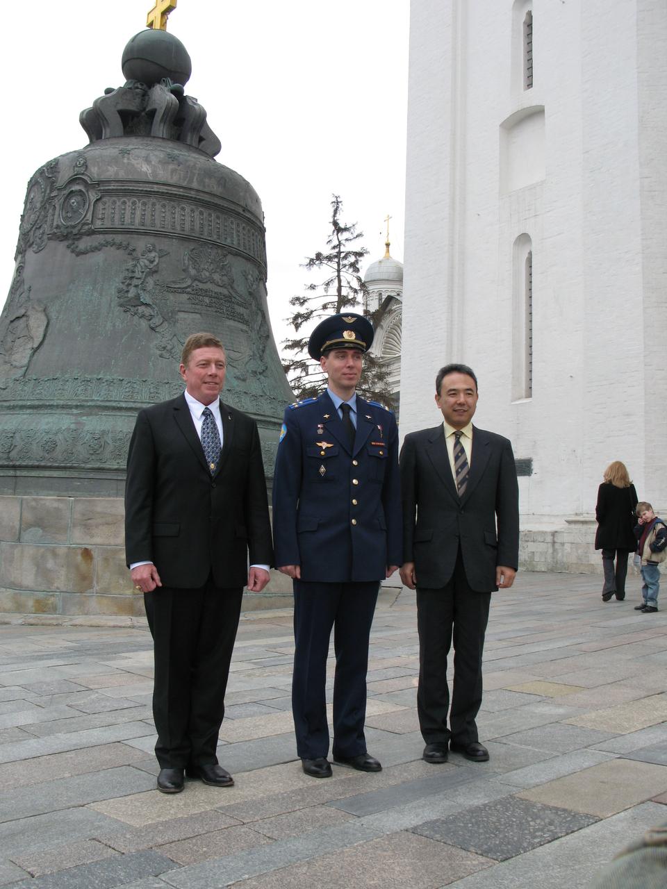 Inside the Kremlin in Moscow, Expedition 28 Flight Engineer Mike Fossum of NASA (left), Soyuz Commander Sergei Volkov (center) and Flight Engineer Satoshi Furukawa (right) pose for pictures May 16, 2011 in front of the Tsar Bell as part of their traditional activities for their launch June 8 from the Baikonur Cosmodrome in Kazakhstan to the International Space Station.
