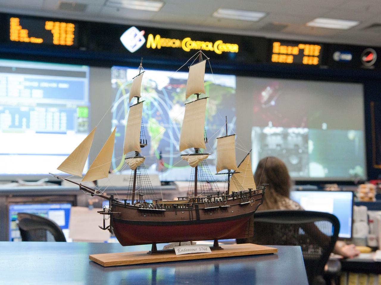 JSC2011-E-046588 (20 May 2011) --- A scale model of HM Bark Endeavour, namesake for the space shuttle currently making its final flight, adorns a console in the space shuttle flight control room in Mission Control in Houston. This model was first displayed in 1992 in the old shuttle control room during STS-49, the inaugural flight of the shuttle Endeavour.  It was built by Dan Willett of JSC's Information Resources Directorate.    The original sailing ship Endeavour was commanded by Lt. James Cook on a scientific voyage to the South Pacific, Australia and New Zealand from 1768 to 1771.  Photo credit: NASA