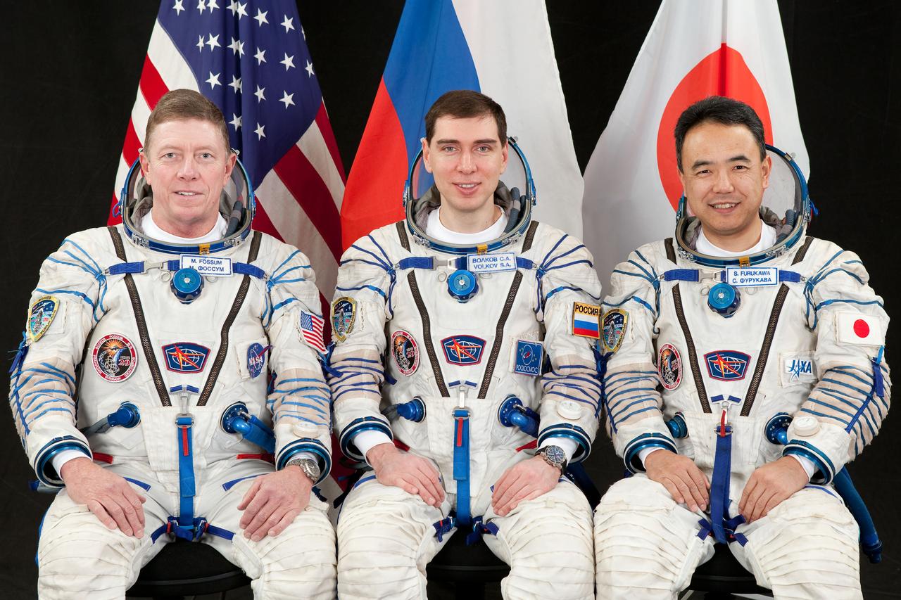 JSC2011-E-046614 (14 Feb. 2011) --- Attired in Russian Sokol launch and entry suits, NASA astronaut Mike Fossum (left), Expedition 28 flight engineer and Expedition 29 commander; along with Russian cosmonaut Sergei Volkov and Japan Aerospace Exploration Agency astronaut Satoshi Furukawa, both Expedition 28/29 flight engineers, take a break from training in Star City, Russia to pose for a portrait. Photo credit: Gagarin Cosmonaut Training Center