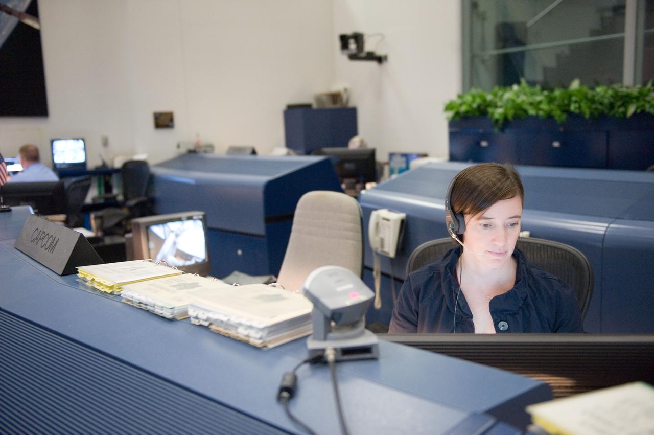 JSC2011-E-046802 (19 May 2011) --- NASA astronaut Megan McArthur, STS-134 spacecraft communicator (CAPCOM), monitors data at her console in the space shuttle flight control room in the Mission Control Center at NASA's Johnson Space Center during flight day four activities. Photo credit: NASA