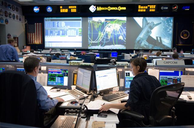 NASA image: STS-134 Orbit 1 flight controllers on console during AMS install 