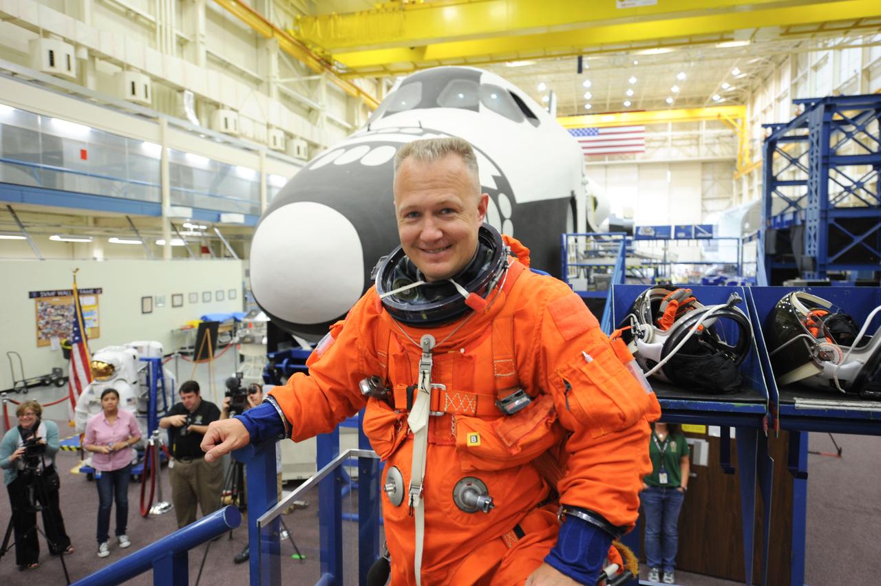 JSC2011-E-050015 (24 May 2011) --- NASA astronaut Doug Hurley, STS-135 pilot, attired in a training version of the shuttle launch and entry suit, is pictured during an ingress/egress training session in the Space Vehicle Mock-up Facility at NASA's Johnson Space Center. Photo credit: NASA
