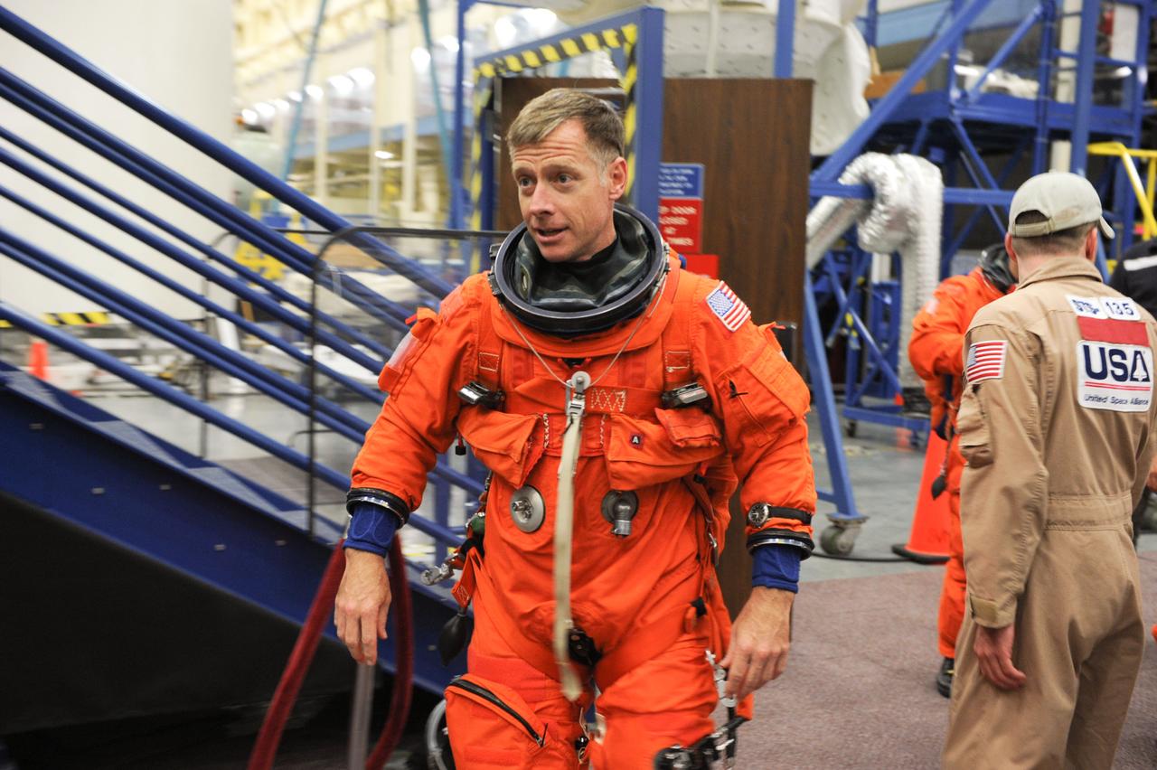 JSC2011-E-050072 (24 May 2011) --- NASA astronaut Chris Ferguson, STS-135 commander, attired in a training version of the shuttle launch and entry suit, is pictured during an ingress/egress training session in the Space Vehicle Mock-up Facility at NASA's Johnson Space Center. Photo credit: NASA