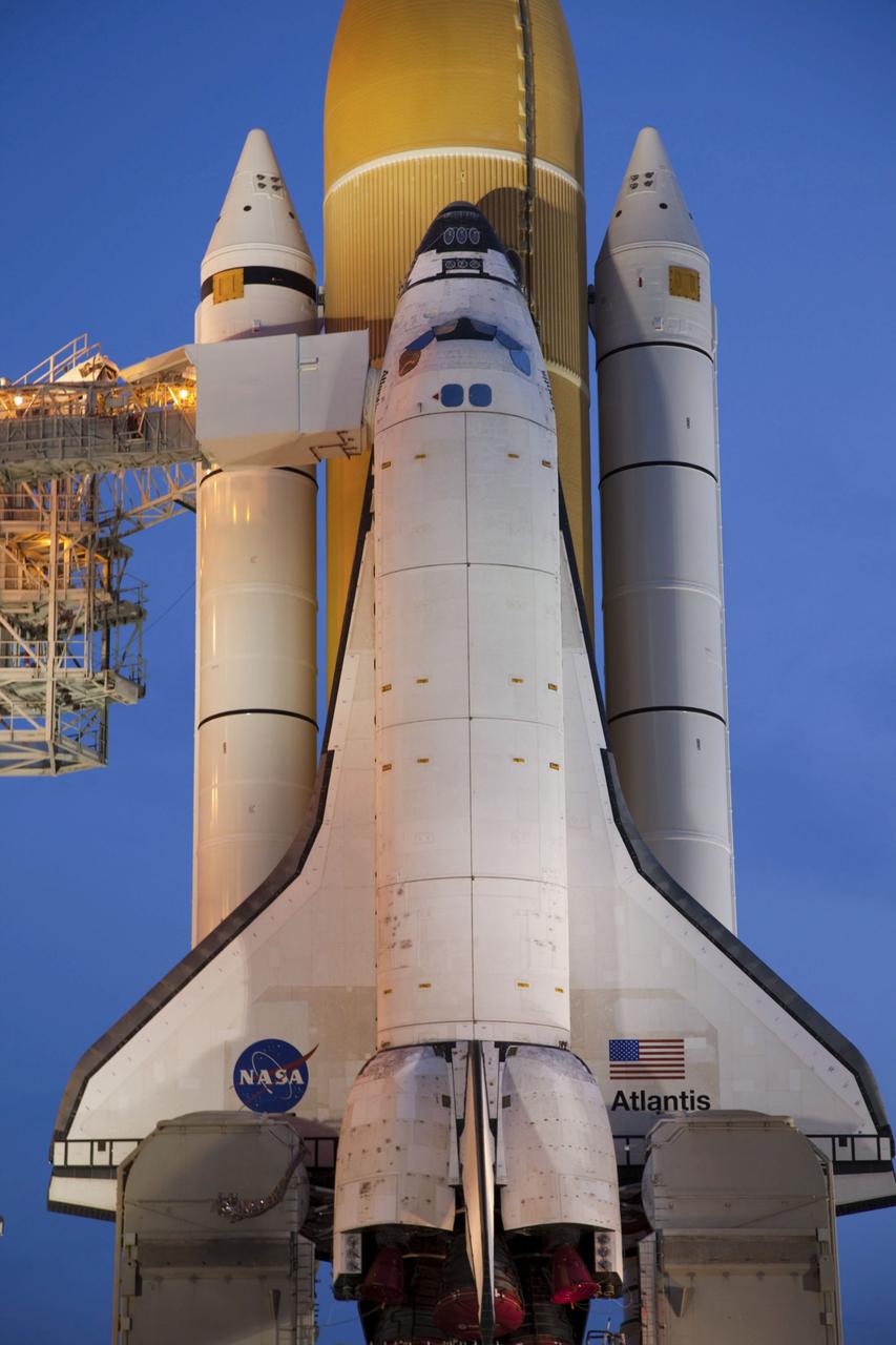 JSC2011-E-050268 (1 June 2011) --- Sunrise at Launch Pad 39A at NASA's Kennedy Space Center in Florida finds space shuttle Atlantis after completing its historic and final journey from the Vehicle Assembly Building. Atlantis was secured or "hard down," at its seaside launch pad at 3:29 a.m. (EDT) on June 1, 2011. The milestone move, known as "rollout," paves the way for the launch of the STS-135 mission to the International Space Station, targeted for July 8. STS-135 will be the 33rd flight of Atlantis, the 37th shuttle mission to the space station, and the 135th and final mission of NASA's Space Shuttle Program. Photo credit: NASA