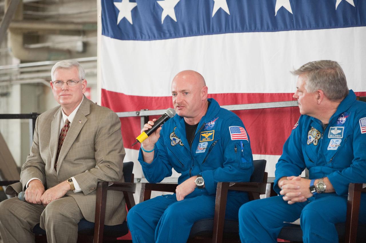 JSC2011-E-050732 (2 June 2011) --- NASA's Johnson Space Center (JSC) director Michael L. Coats (left), along with astronauts Mark Kelly, STS-134 commander; and Greg H. Johnson, pilot, are pictured during the STS-134 crew return ceremony on June 2, 2011 at Ellington Field near JSC. Photo credit: NASA