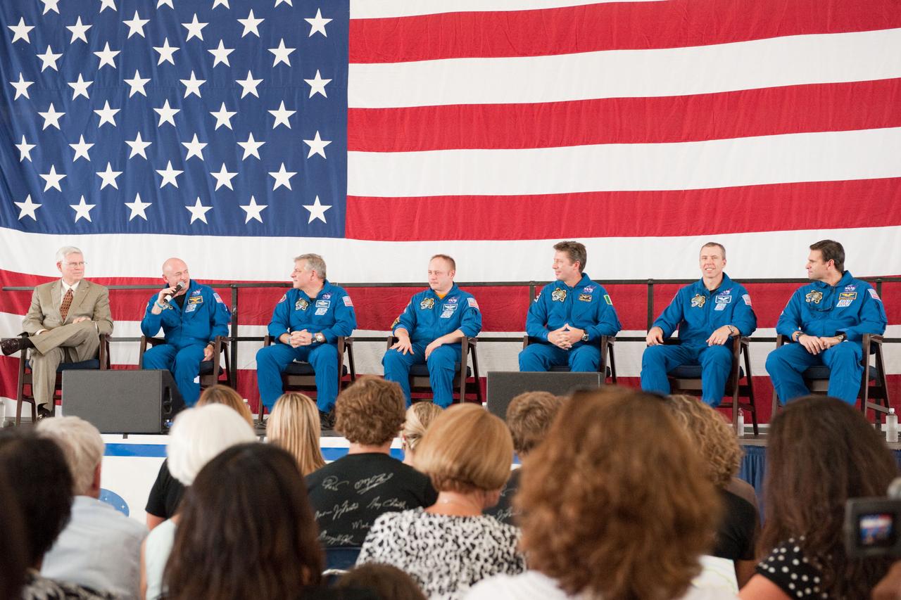 JSC2011-E-050737 (2 June 2011) --- NASA's Johnson Space Center (JSC) director Michael L. Coats (left) and STS-134 crew members are pictured during the STS-134 crew return ceremony on June 2, 2011 at Ellington Field near JSC. Pictured from second left are NASA astronauts Mark Kelly, commander; Greg H. Johnson, pilot; Michael Fincke, European Space Agency?s Roberto Vittori, NASA astronauts Andrew Feustel and Greg Chamitoff, all mission specialists. Photo credit: NASA