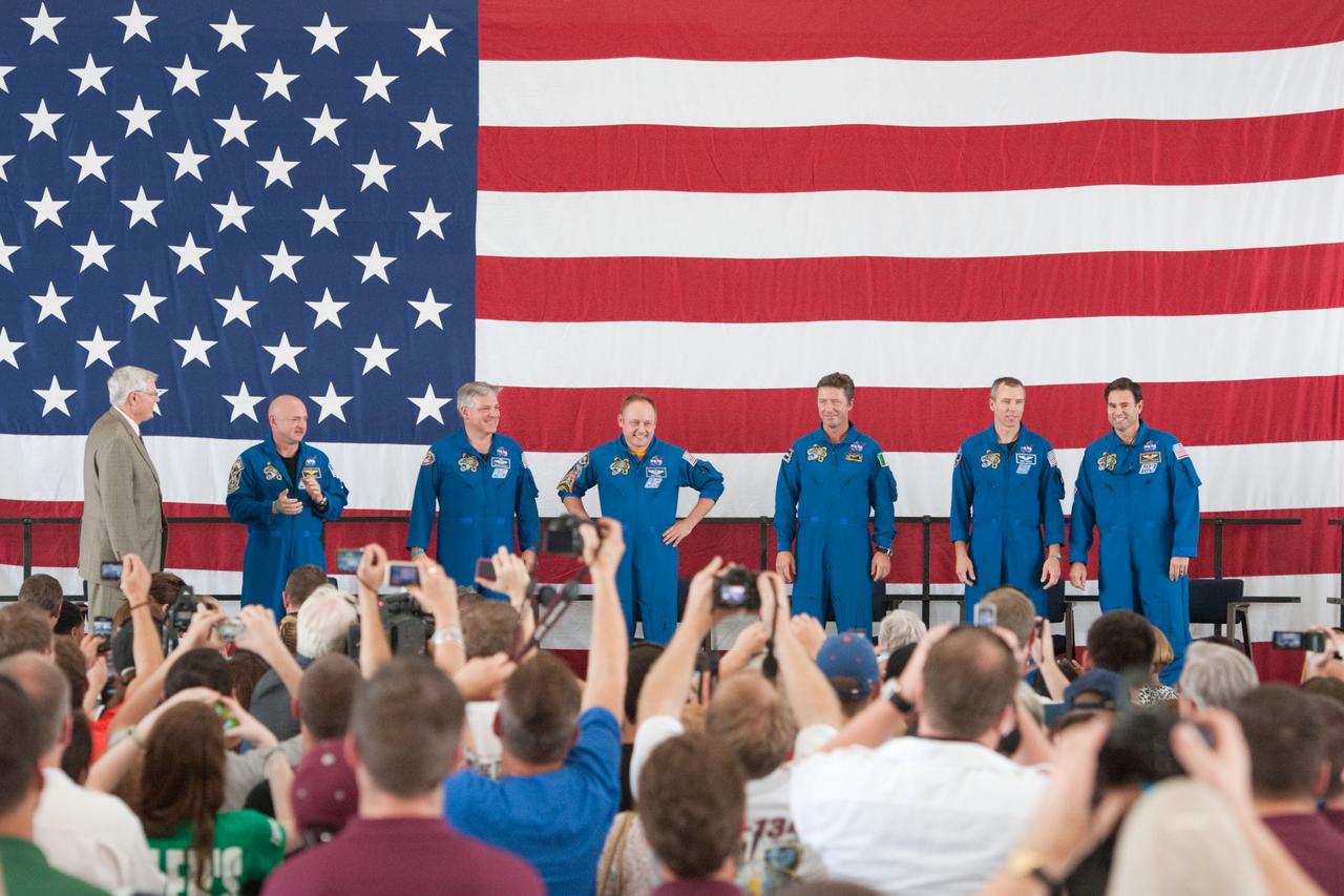 JSC2011-E-050741 (2 June 2011) --- NASA's Johnson Space Center (JSC) director Michael L. Coats (left) and STS-134 crew members are pictured during the STS-134 crew return ceremony on June 2, 2011 at Ellington Field near JSC. Pictured from second left are NASA astronauts Mark Kelly, commander; Greg H. Johnson, pilot; Michael Fincke, European Space Agency?s Roberto Vittori, NASA astronauts Andrew Feustel and Greg Chamitoff, all mission specialists. Photo credit: NASA