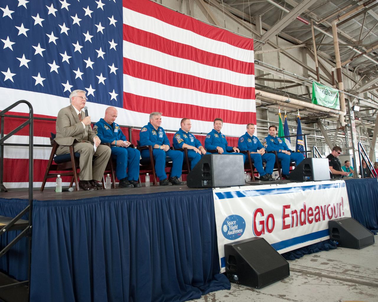 JSC2011-E-050763 (2 June 2011) --- NASA's Johnson Space Center (JSC) director Michael L. Coats (left) and STS-134 crew members are pictured during the STS-134 crew return ceremony on June 2, 2011 at Ellington Field near JSC. Pictured from second left are NASA astronauts Mark Kelly, commander; Greg H. Johnson, pilot; Michael Fincke, European Space Agency?s Roberto Vittori, NASA astronauts Andrew Feustel and Greg Chamitoff, all mission specialists. Photo credit: NASA