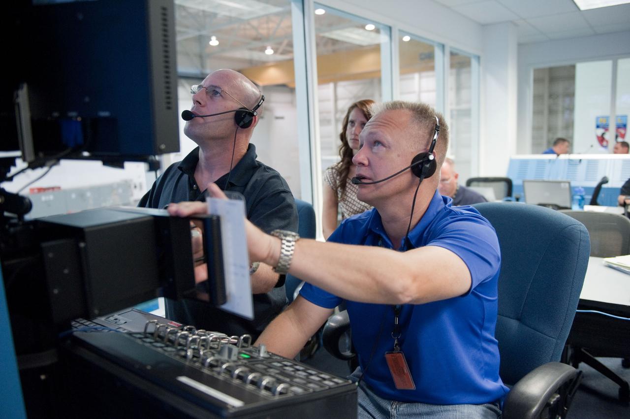 JSC2011-E-054081 (13 June 2011) --- NASA astronaut Doug Hurley (right), STS-135 pilot, participates in a training session in the simulation control area in the Neutral Buoyancy Laboratory (NBL) at the Sonny Carter Training Facility near NASA's Johnson Space Center. Photo credit: NASA