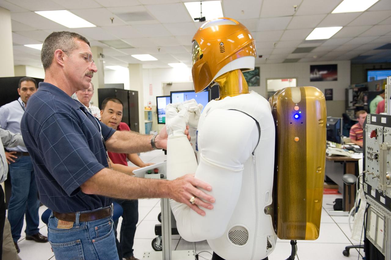 Expedition 29/30 crew training with astronaut Dan Burbank working with Robonaut (overview, skills, taskboard).  Photo Date: June 17, 2011.  Location: Building 32A, Room 2009.  Photographer: Robert Markowitz