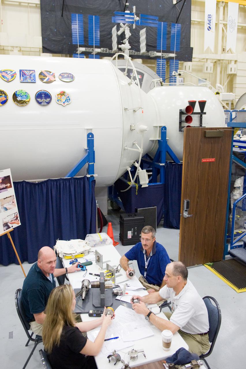 PHOTO DATE: 06-23-11 LOCATION: Bld 9NW SUBJECT: Expedition 29 crew members, Dan Burbank, Don Pettit and Andre Kuiper during EVA Fluid QD Ops with instructor Sandra Moore WORK ORDER: 2011-1643 PHOTOGRAPHER: James Blair