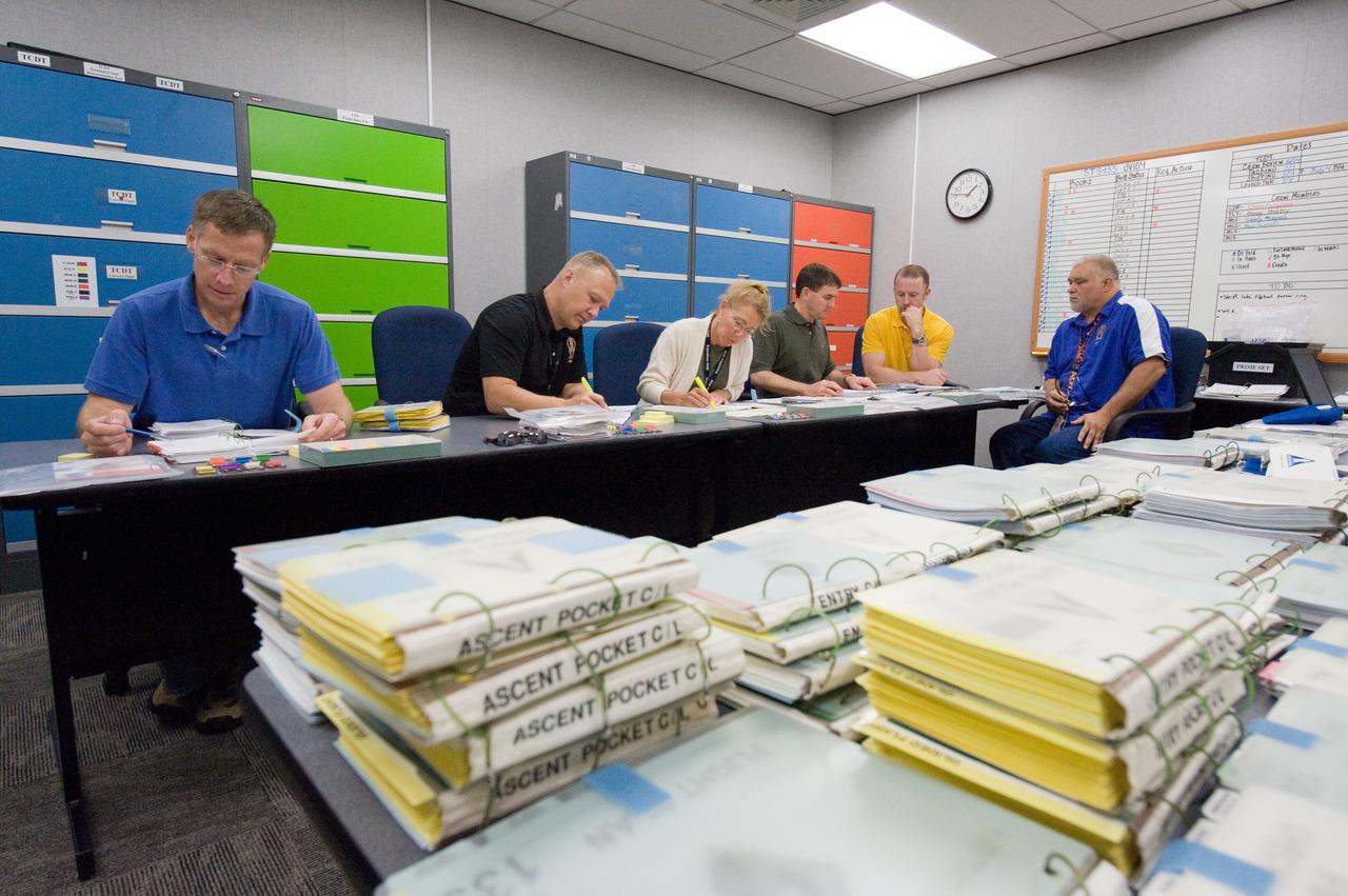 JSC2011-E-058628 (24 June 2011) --- STS-135 crew members participate in a flight data file review in the Flight Operations Facility at NASA?s Johnson Space Center. Pictured from the left are NASA astronauts Chris Ferguson, commander; Doug Hurley, pilot; along with Sandy Magnus and Rex Walheim, both mission specialists. Photo credit: NASA