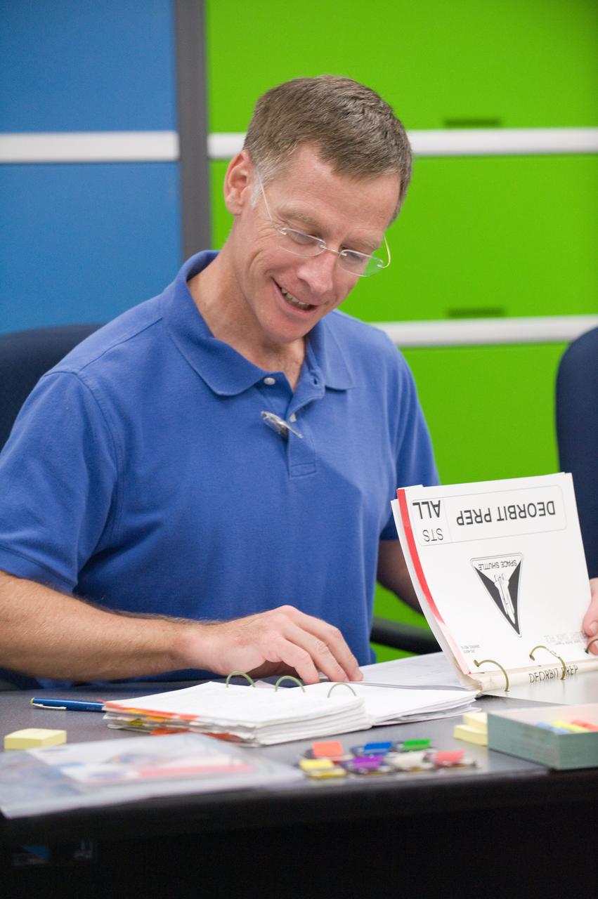 JSC2011-E-058630 (24 June 2011) --- NASA astronaut Chris Ferguson, STS-135 commander, participates in a flight data file review in the Flight Operations Facility at NASA?s Johnson Space Center. Photo credit: NASA