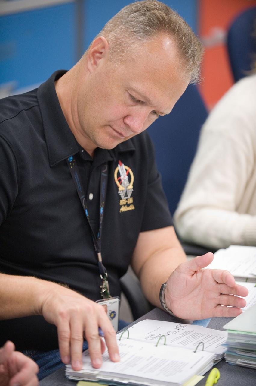 JSC2011-E-058646 (24 June 2011) --- NASA astronaut Doug Hurley, STS-135 pilot, participates in a flight data file review in the Flight Operations Facility at NASA?s Johnson Space Center. Photo credit: NASA