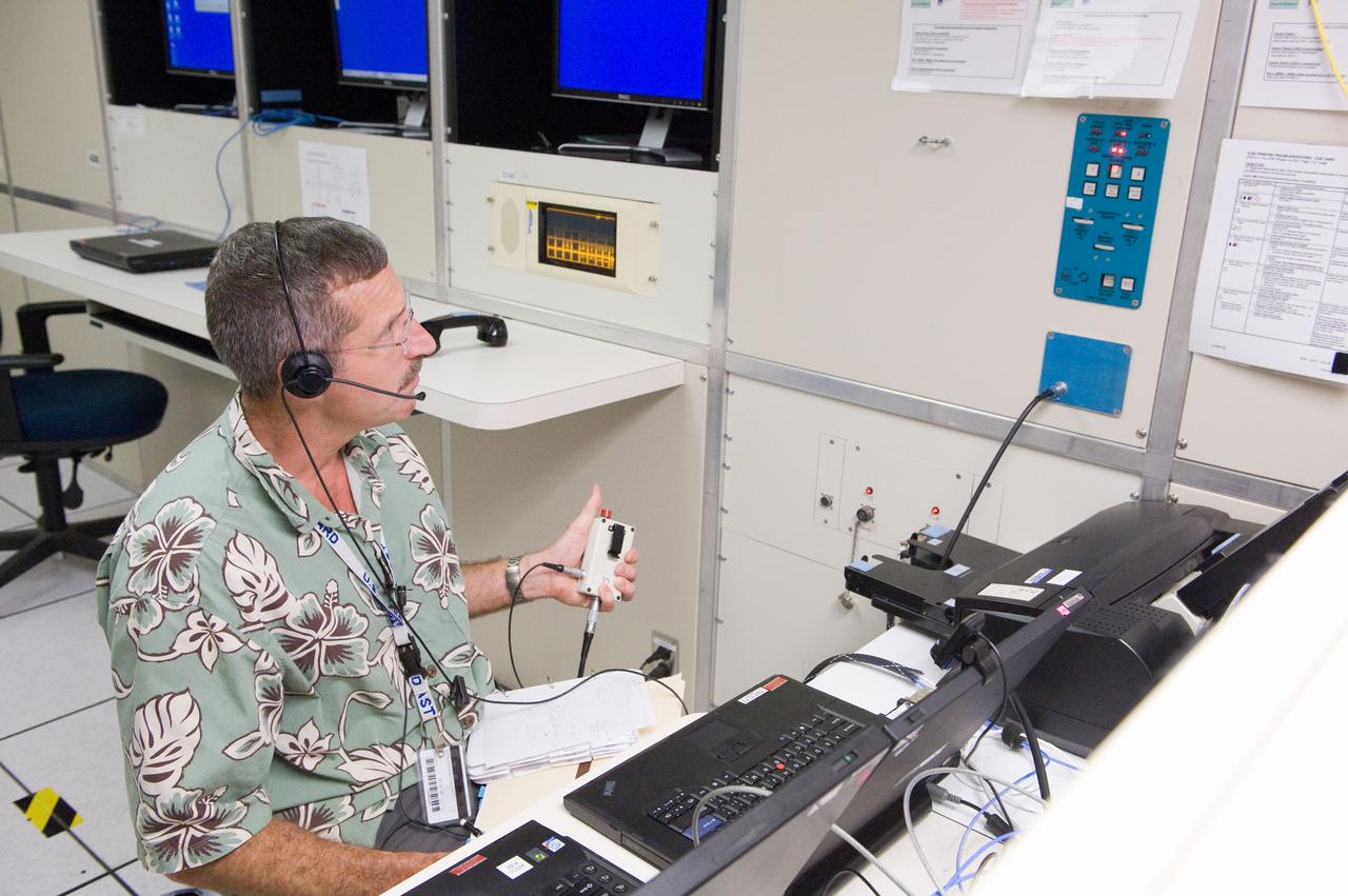 PHOTO DATE: 22 June 2011 LOCATION: Bldg. 5, Space Station Training Facility. SUBJECT: Expedition 29/30 crew training during Electrical Power System Major Case training event. Astronauts Dan Burbank, Don Pettit and Andre Kuipers working together in mockup. PHOTOGRAPHER: Mark Sowa