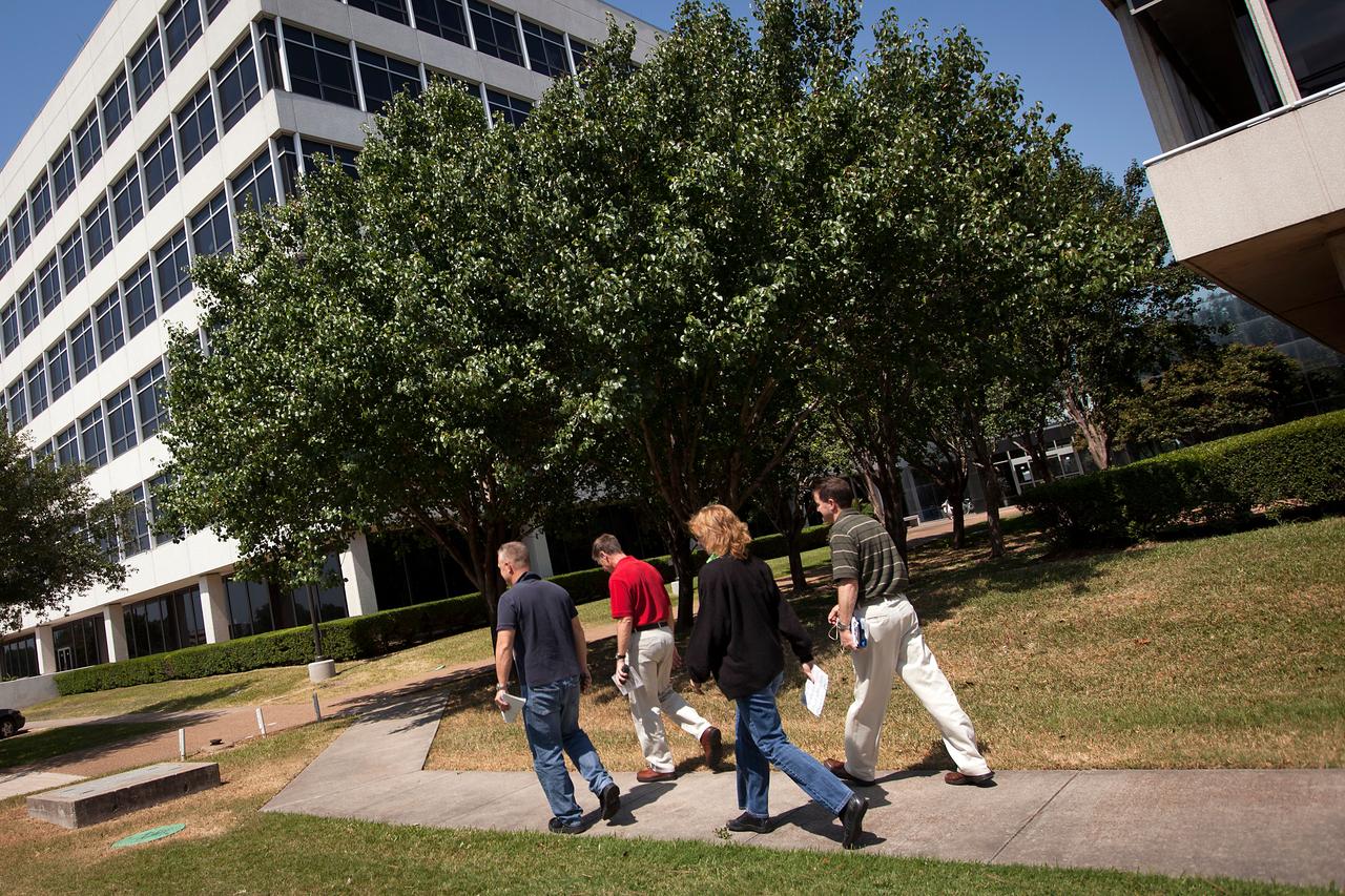 The crew of STS-135, from left, Doug Hurley, Chris Ferguson, Sandy Magnus and Rex Walheim walk between buildings at the Johnson Space Center after a simulation in the motion based simulator on Friday, May 6, 2011, in Houston. ( NASA Photo / Houston Chronicle, Smiley N. Pool ).