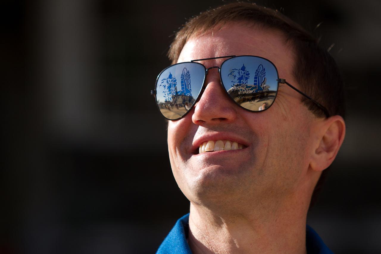 JSC2011-E-059409 (17 May 2011) --- NASA astronaut Rex Walheim, STS-135 mission specialist, watches as the space shuttle Atlantis is moved from the Orbiter Processing Facility to the Vehicle Assembly Building at NASA?s Kennedy Space Center on May 17, 2011. The move, known as rollover, is a milestone in the preparation for launch as the orbiter leaves its processing hangar to be prepped for its final flight. Photo credit: NASA Photo/Houston Chronicle, Smiley N. Pool