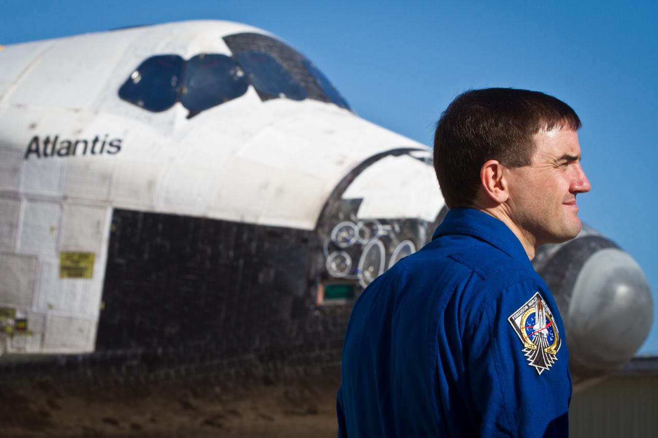 JSC2011-E-059411 (17 May 2011) --- NASA astronaut Rex Walheim, STS-135 mission specialist, watches as the space shuttle Atlantis is moved May 17, 2011. The move, known as rollover, is a milestone in the preparation for launch as the orbiter leaves its processing hangar to be prepped for its final flight. Photo credit: NASA Photo/Houston Chronicle, Smiley N. Pool