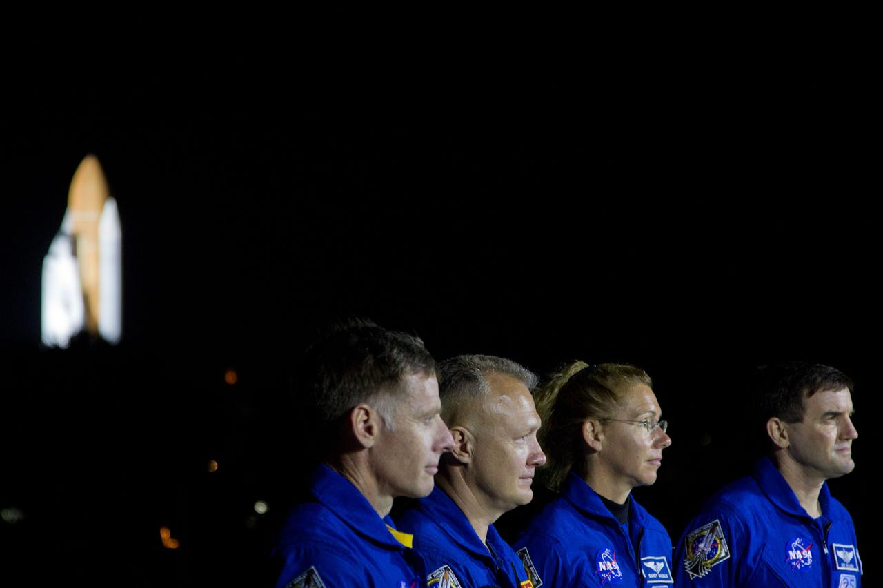 JSC2011-E-059446 (31 May 2011) --- The crew of the space shuttle Atlantis, from left, commander Chris Ferguson, pilot Doug Hurley and mission specialists Sandy Magnus and Rex Walheim address a news conference as the shuttle moves to Launch Pad 39A during rollout at NASA?s Kennedy Space Center in Florida on May 31, 2011. Photo credit: NASA Photo/Houston Chronicle, Smiley N. Pool