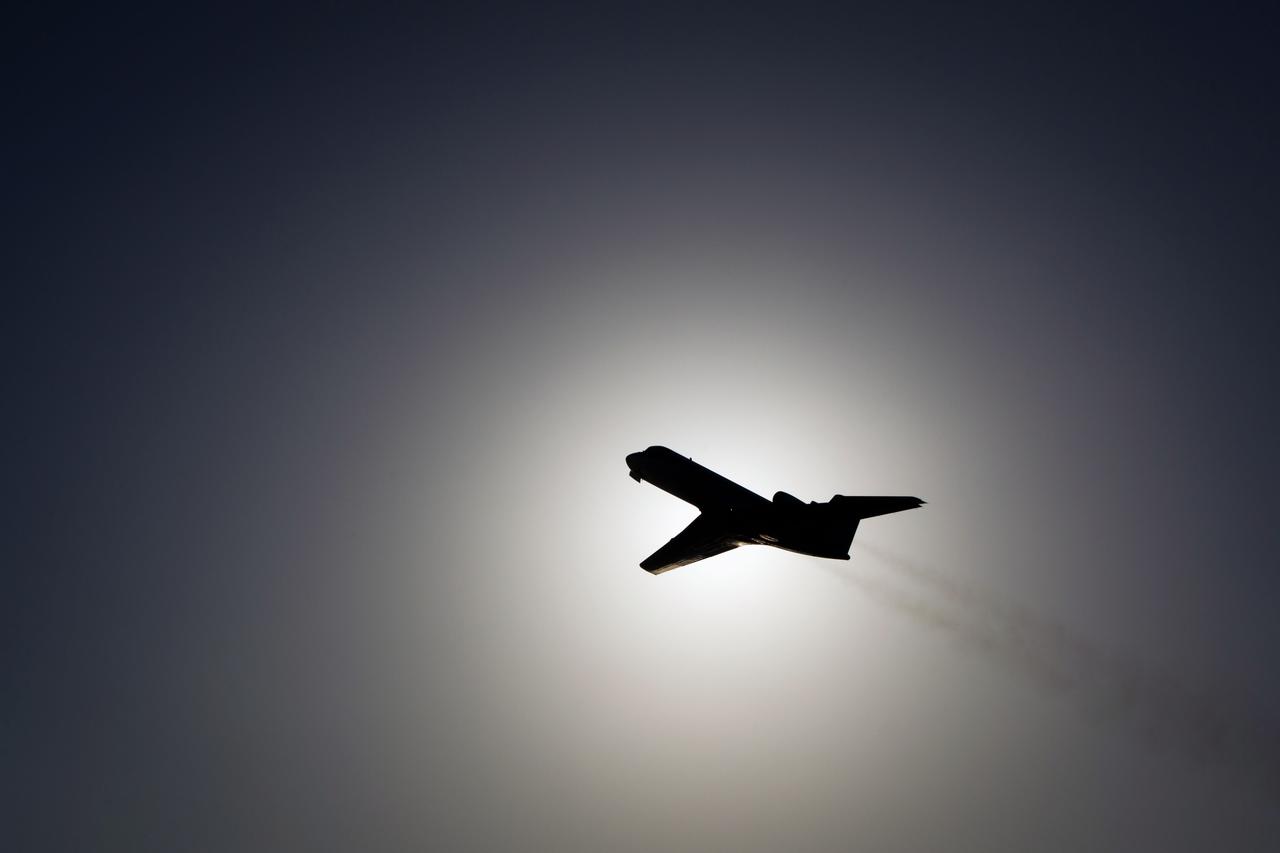 JSC2011-E-059484 (31 May 2011) --- A Shuttle Training Aircraft (STA) piloted by NASA astronaut Chris Ferguson, STS-135 commander, is seen against the late afternoon sun as the crew of the final space shuttle mission practices landings at NASA?s Kennedy Space Center in Florida May 31, 2011. Photo credit: NASA Photo/Houston Chronicle, Smiley N. Pool