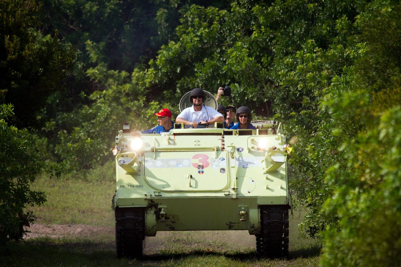 JSC2011-E-059634 (21 June 2011) --- NASA astronaut Sandy Magnus, STS-135 mission specialist, drives the M113 personnel carrier in a safety training exercise during the Terminal Countdown Demonstration Test (TCDT) at NASA?s Kennedy Space Center June 21, 2011. TCDT serves as the prelaunch countdown rehearsal for the final space shuttle mission, which is scheduled for launch on July 8. The M113 would be used in the event of an emergency at the pad forcing the crew to evacuate. Photo credit: NASA Photo/Houston Chronicle, Smiley N. Pool
