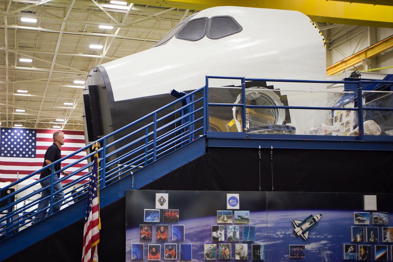 JSC2011-E-060144 (29 June 2011) --- NASA astronaut Doug Hurley, STS-135 pilot, walks up the stairs to the Crew Compartment Trainer (CCT) mock-up as the crew of STS-135 trains June 29, 2011 at NASA?s Johnson Space Center, Houston. The training marked the crew's final scheduled session in the Space Vehicle Mock-up Facility. Photo credit: NASA photo/Houston Chronicle, Smiley N. Pool
