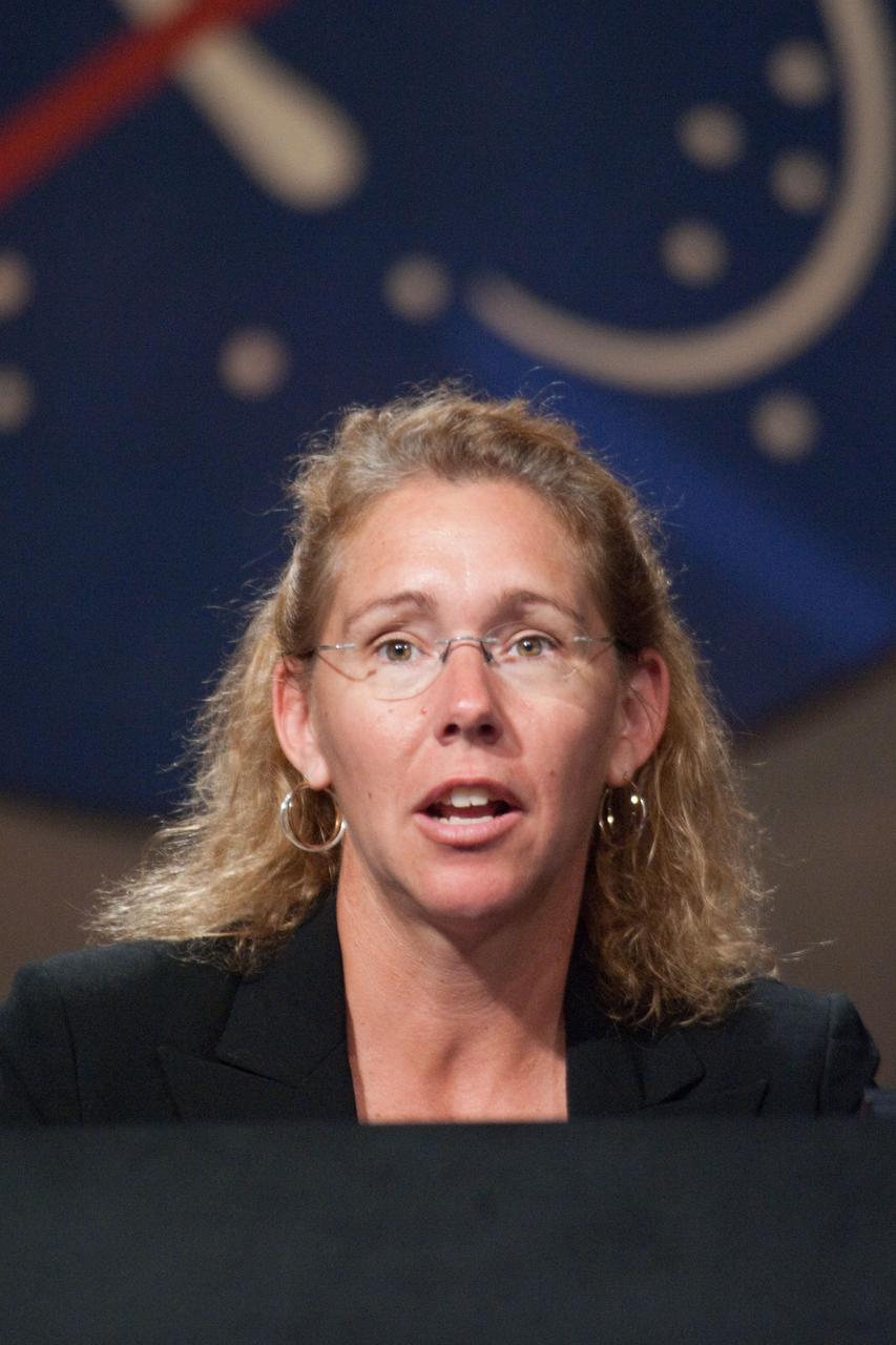 JSC2011-E-060445 (30 June 2011) --- NASA astronaut Sandy Magnus, STS-135 mission specialist, responds to a question from a reporter during a preflight press conference at NASA's Johnson Space Center. Photo credit: NASA