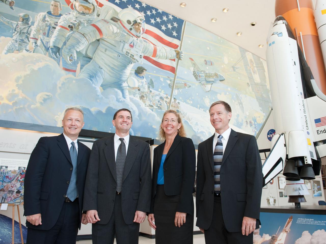 JSC2011-E-060459 (30 June 2011) --- STS-135 crew members are pictured following a preflight press conference at NASA's Johnson Space Center. From the right are NASA astronauts Chris Ferguson, commander; Sandy Magnus and Rex Walheim, both mission specialists; and Doug Hurley, pilot. Photo credit: NASA