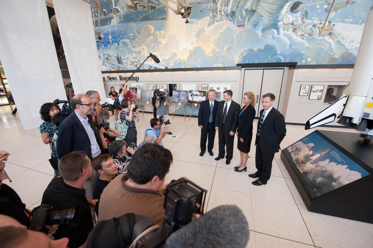JSC2011-E-060482 (30 June 2011) --- STS-135 crew members speak to news media representatives following a preflight press conference at NASA's Johnson Space Center. From the right are NASA astronauts Chris Ferguson, commander; Sandy Magnus and Rex Walheim, both mission specialists; and Doug Hurley, pilot. Photo credit: NASA