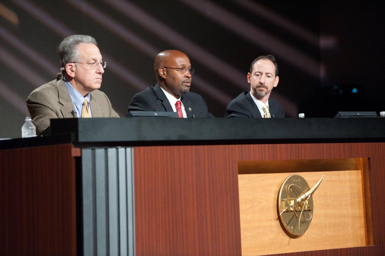 JSC2011-E-060718 (30 June 2011) --- STS-135 flight directors Kwatsi Alibaruho (center) and Chris Edelen along with Public Affairs Office moderator Rob Navias (left) are pictured during a mission overview press conference at NASA's Johnson Space Center. Photo credit: NASA