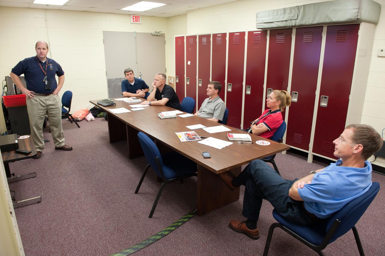 JSC2011-E-060748 (29 June 2011) --- STS-135 crew members are pictured during a training session in the Space Vehicle Mock-up Facility at NASA's Johnson Space Center. Seated from the right are NASA astronauts Chris Ferguson, commander; Sandy Magnus and Rex Walheim, both mission specialists; and Doug Hurley, pilot. Photo credit: NASA