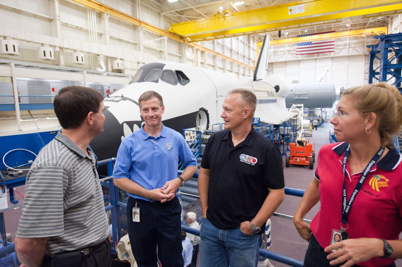 JSC2011-E-060762 (29 June 2011) --- STS-135 crew members are pictured during a training session in the Space Vehicle Mock-up Facility at NASA's Johnson Space Center. Pictured are NASA astronauts Chris Ferguson (center left), commander; Doug Hurley (center right), pilot; Rex Walheim and Sandy Magnus, both mission specialists. Photo credit: NASA