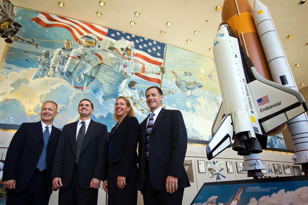 JSC2011-E-060793 (30 June 2011) --- The crew of STS-135, from left, pilot Doug Hurley, mission specialists Rex Walheim and Sandy Magnus, and commander Chris Ferguson pose for a group photo following the crew media briefing at the Johnson Space Center in Houston on June 30, 2011. Photo credit: NASA Photo/Houston Chronicle, Smiley N. Pool