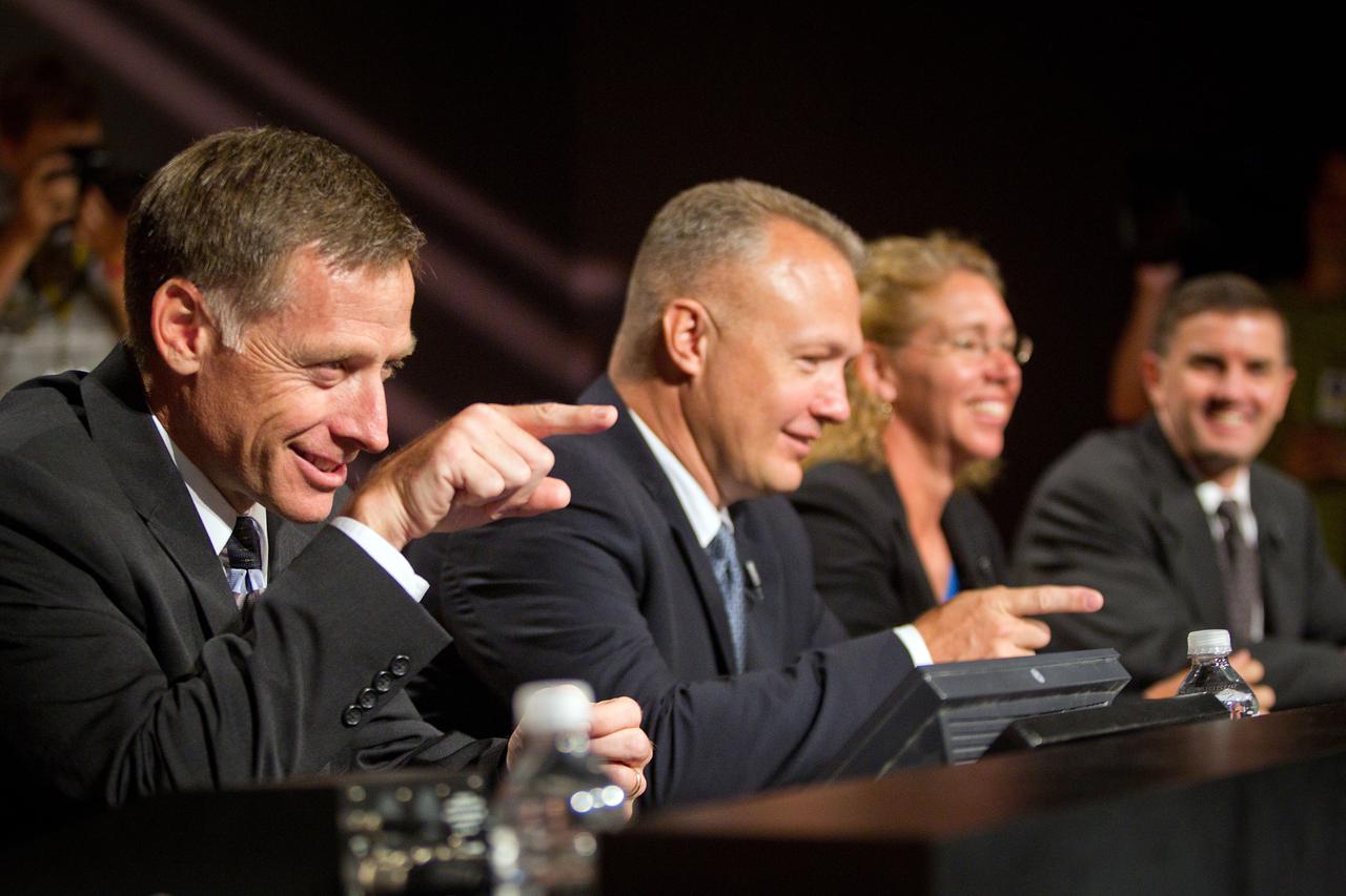 JSC2011-E-060794 (30 June 2011) --- NASA astronaut Chris Ferguson, STS-135 commander, points to acknowledge a reporter while greeting the media along with NASA astronauts Doug Hurley, pilot, and Sandy Magnus and Rex Walheim, both mission specialists, during the STS-135 crew media briefing at NASA?s Johnson Space Center June 30, 2011. The press conference provided the last scheduled opportunity for a large group of press to speak with the crew before the final launch on July 8. Photo credit: NASA Photo/Houston Chronicle, Smiley N. Pool