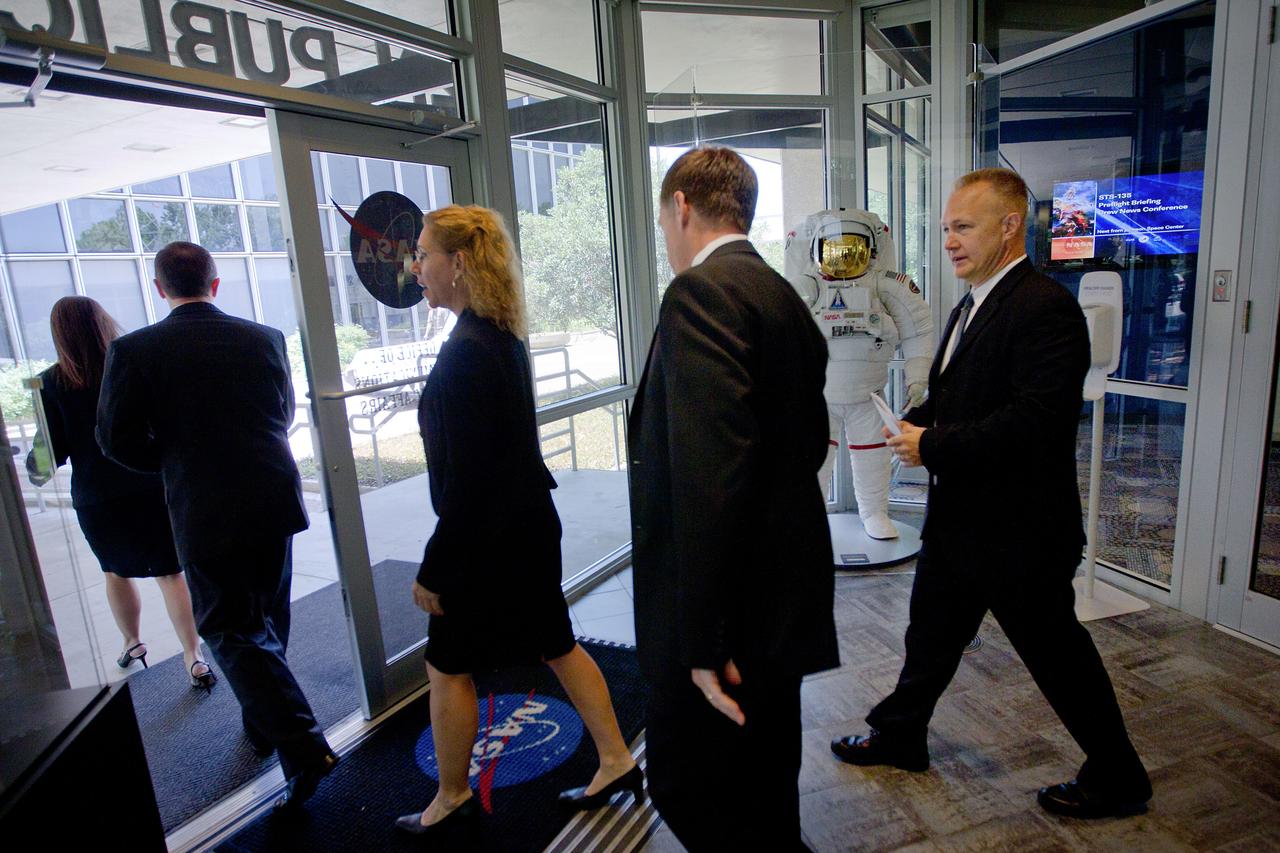 JSC2011-E-060798 (30 June 2011) --- The STS-135 crew, from left, mission specialists Sandy Magnus and Rex Walheim, commander Chris Ferguson and pilot Doug Hurley follow Public Affairs Officer Nicole Cloutier-Lemasters to begin a crew media briefing at NASA?s Johnson Space Center on June 30, 2011. The press conference provided the last scheduled opportunity for a large group of press to speak with the crew before the final launch on July 8. Photo credit: NASA Photo/Houston Chronicle, Smiley N. Pool