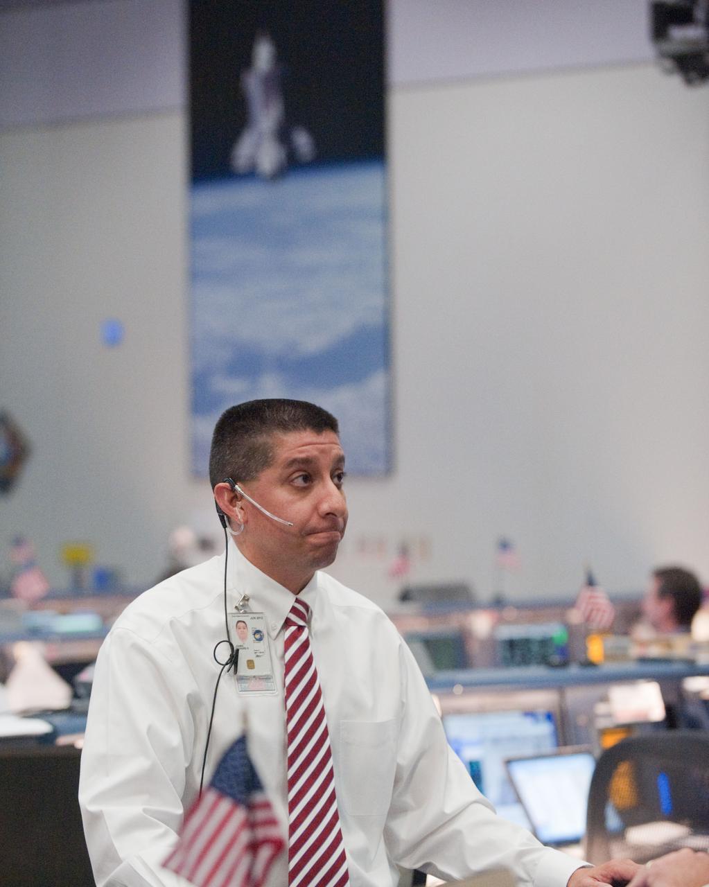 PHOTO DATE: 08 July 2011 LOCATION: Bldg. 30 south - WFCR, SMG SUBJECT: STS-135 Flight Controllers on Console during last space shuttle launch WORK ORDER:  01815-BS___07-08-11-STS 135 LAUNCH WFCR PHOTOGRAPHER: Bill Stafford