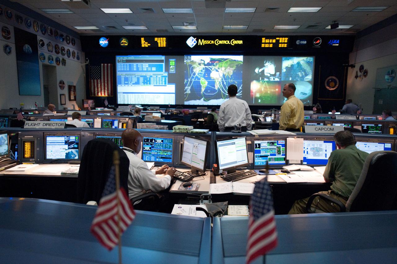 PHOTO DATE: 12 July 2011 LOCATION: Bldg. 30 FCR-1, EVA, WFCR & Bldg. 7 EVA Center. SUBJECT: STS-135 flight controllers on console for EVA. PHOTOGRAPHER: Mark Sowa