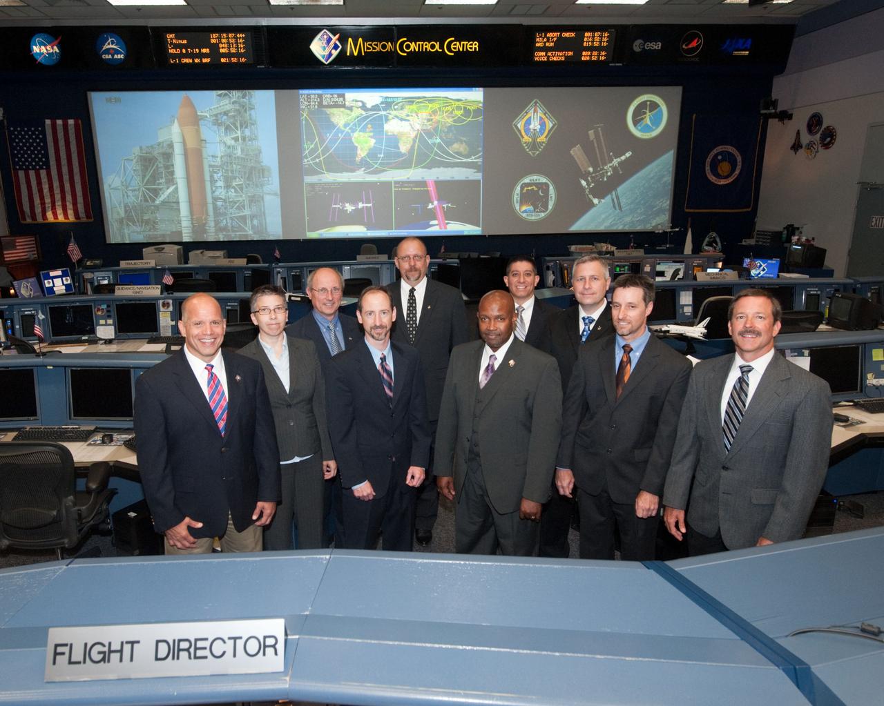 PHOTO DATE:   07-06-11 LOCATION: Bldg. 30 SUBJECT: STS-135 Flight Controllers on Console  WORK ORDER:01910-BS___STS 135 FLIGHT DIRECTORS-07-06-11 PHOTOGRAPHER: BILL STAFFORD