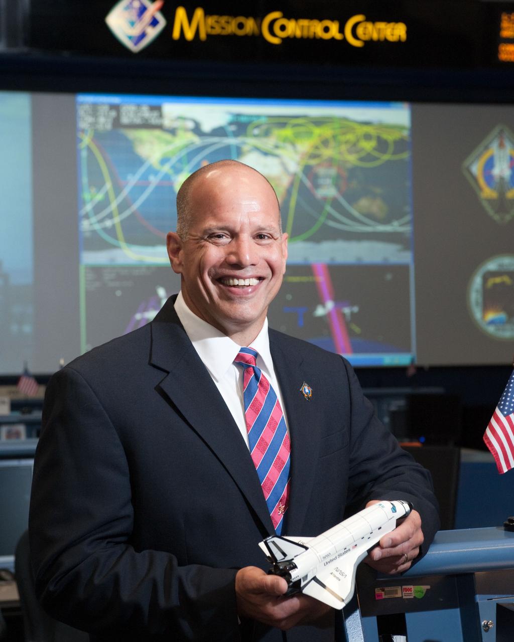 PHOTO DATE:   07-06-11 LOCATION: Bldg. 30 SUBJECT: STS-135 Flight Controllers on Console  WORK ORDER:01910-BS___STS 135 FLIGHT DIRECTORS-07-06-11 PHOTOGRAPHER: BILL STAFFORD