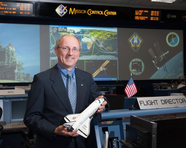 NASA image: STS-135 Flight Controllers on Console 