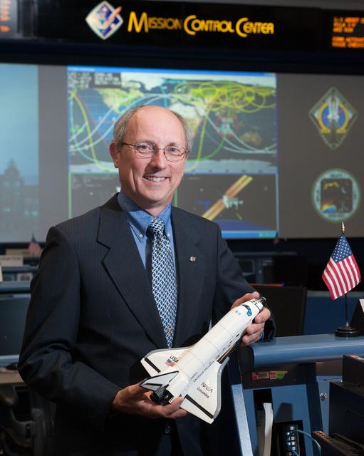 NASA image: STS-135 Flight Controllers on Console 
