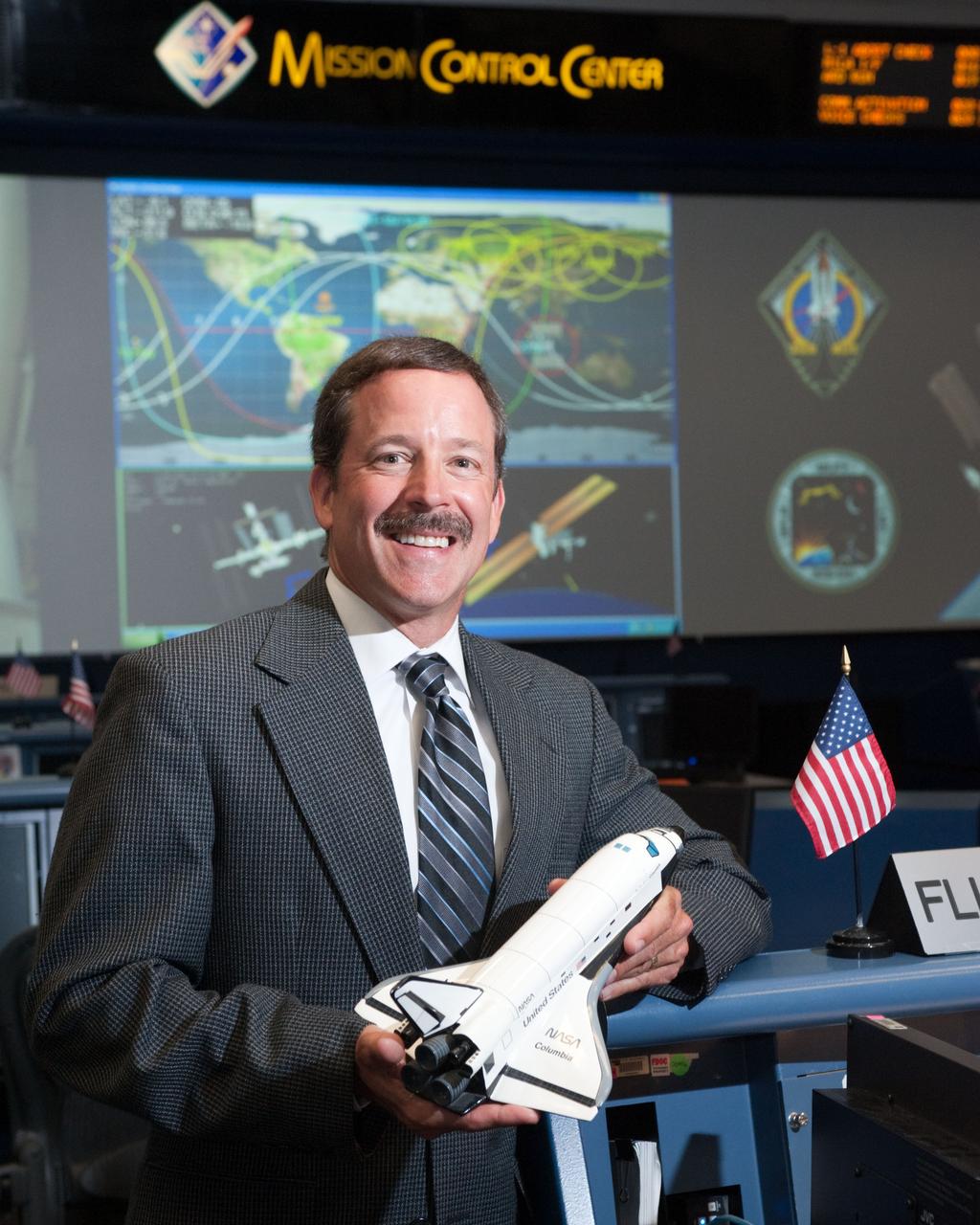 PHOTO DATE:   07-06-11 LOCATION: Bldg. 30 SUBJECT: STS-135 Flight Controllers on Console  WORK ORDER:01910-BS___STS 135 FLIGHT DIRECTORS-07-06-11 PHOTOGRAPHER: BILL STAFFORD