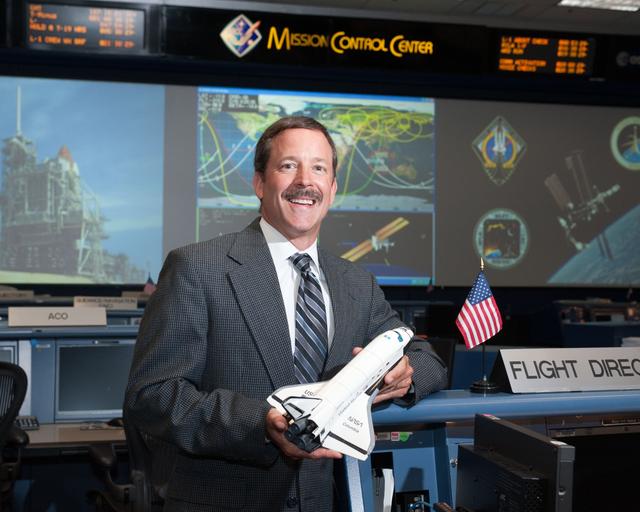 NASA image: STS-135 Flight Controllers on Console 