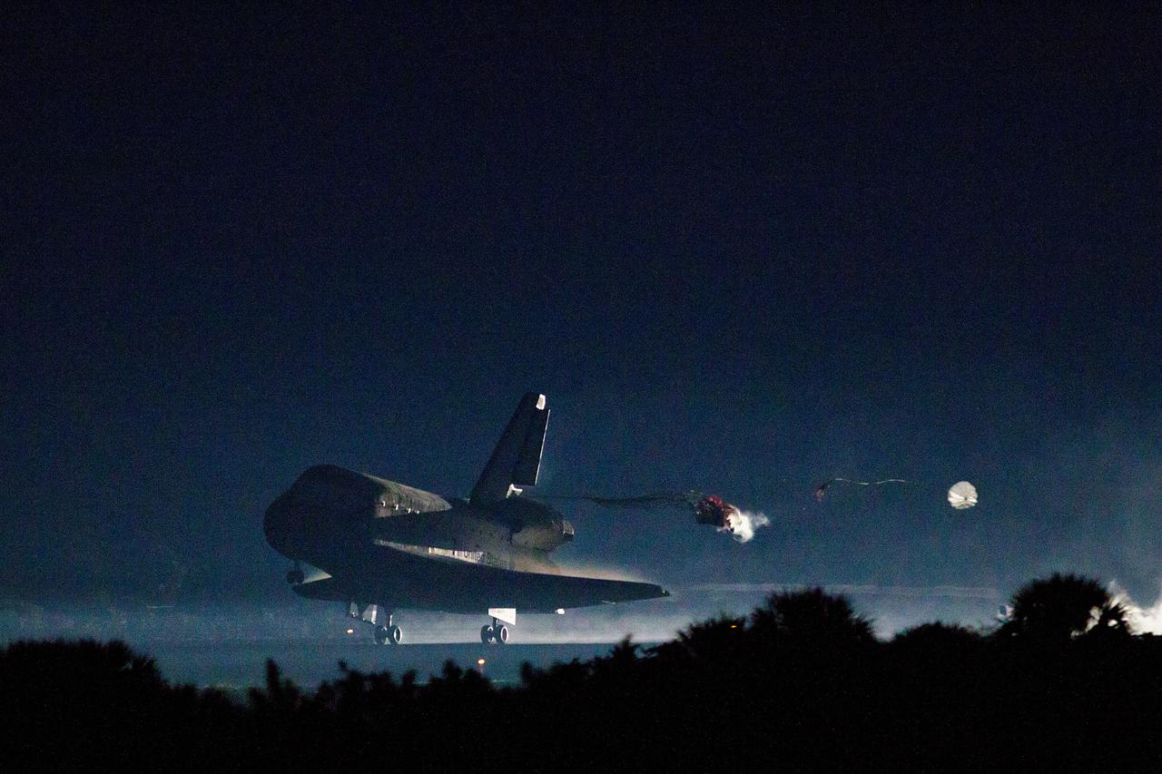 JSC2011-E-067687 (21 July 2011) --- The drag chute is deployed as the space shuttle Atlantis lands on July 21 at the Kennedy Space Center in Florida. The landing completed STS-135, the final mission of the NASA Space Shuttle Program. Photo credit: NASA Photo/Houston Chronicle, Smiley N. Pool