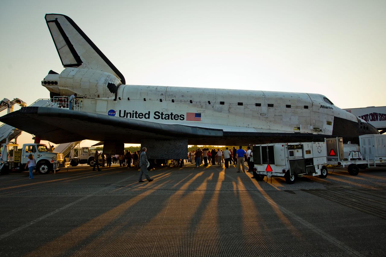 JSC2011-E-067975 (21 July 2011) --- The sun rises over the space shuttle Atlantis after landing July 21 at the Kennedy Space Center in Florida. The landing completed STS-135, the final mission of the NASA Space Shuttle Program. Photo credit: NASA Photo/Houston Chronicle, Smiley N. Pool