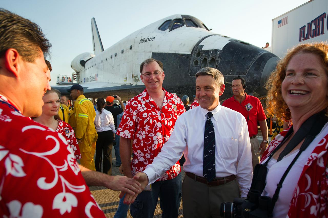 JSC2011-E-068004 (21 July 2011) --- KSC director Bob Cabana, center frame, congratulates members of the damage assessment team after the space shuttle Atlantis landed on July 21 at the Kennedy Space Center in Florida. The landing marked the completion of STS-135, the final mission of the NASA Space Shuttle Program. Photo credit: NASA Photo/Houston Chronicle, Smiley N. Pool