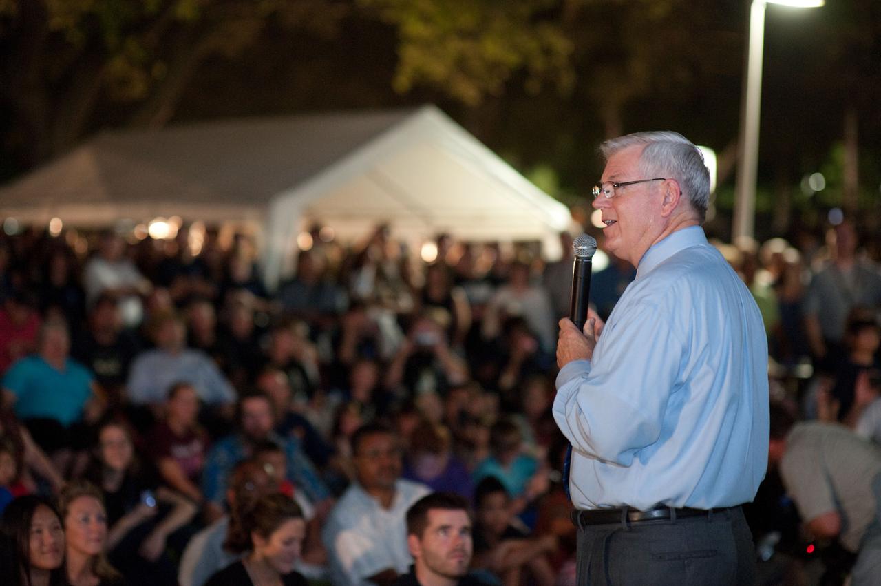 PHOTO DATE: 7-21-11   LOCATION:Bldg 1 - Flag Pole Area    SUBJECT: Viewing of STS-135 Landing on Jumbotron as well as flag ceremony and mini events in Front of Houston JSC Bldg. 1.  Speakers include Astronaut Mike Massimino and JSC Center Director Michael Coats. WORK ORDER: 02027-DCB-LH_Wheel Stop_Bldg. 1_7-21-11  PHOTOGRAPHER: Devin Boldt   